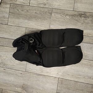 2 pair.. black padded schutt football pants